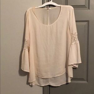 Cream bell sleeve top.